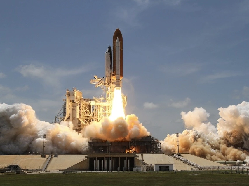 The space shuttle taking off. 