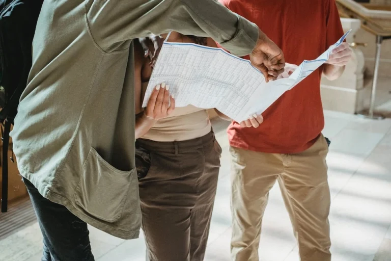 A group of people looking at a map.