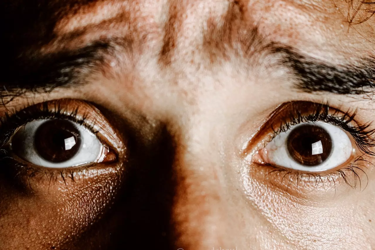 Closeup of a scared man's eyes.