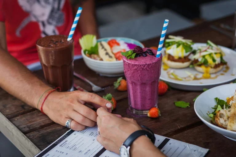Two people on a date holding hands.